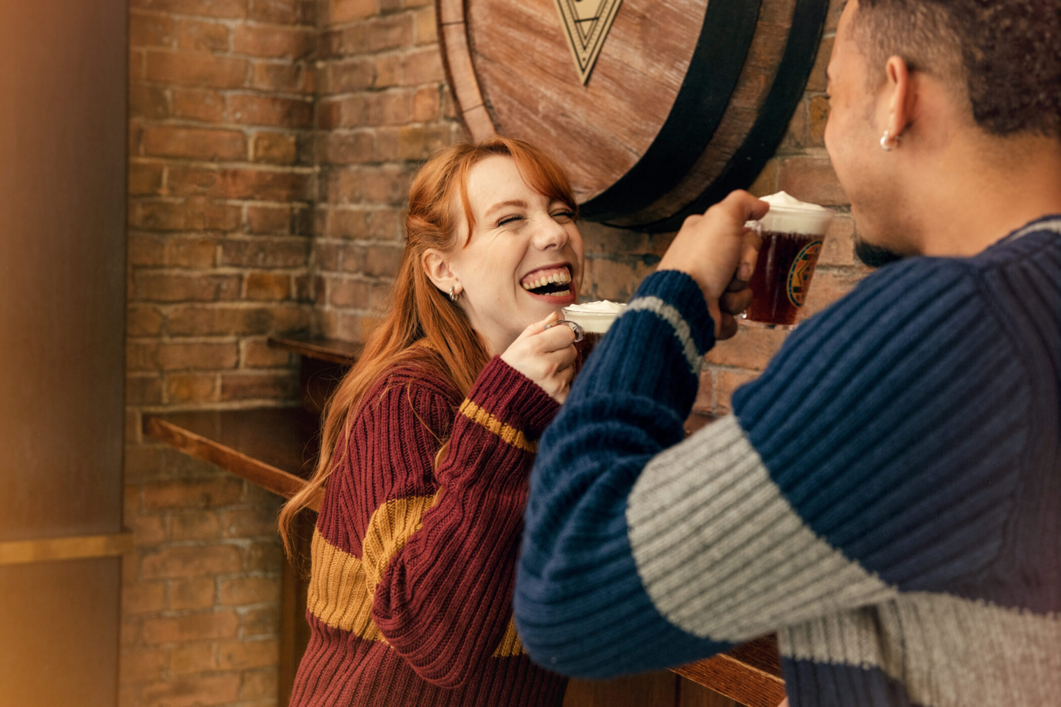 People drinking Butterbeer at Harry Potter Store New York